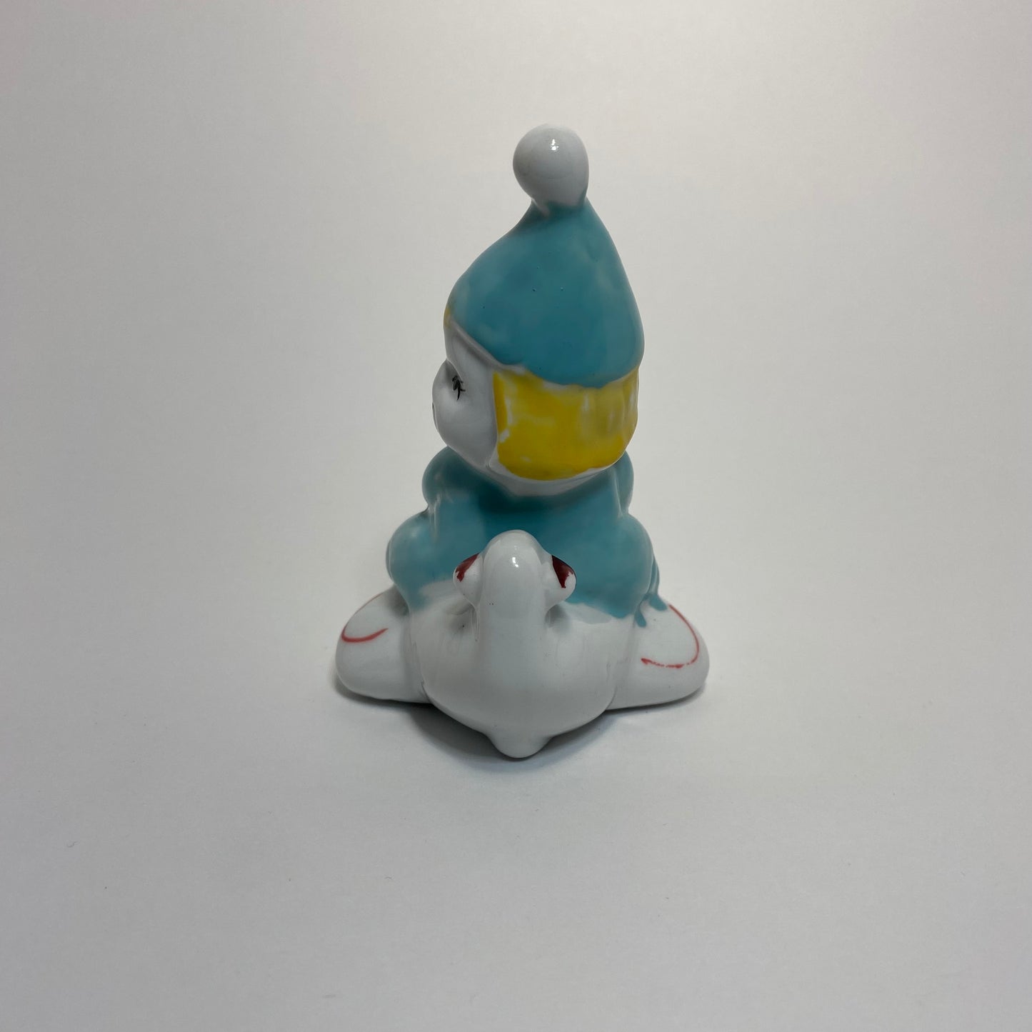 Ceramic Clown on Airplane Figurine