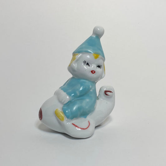 Ceramic Clown on Airplane Figurine