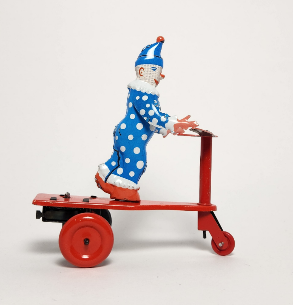 Lemezarugyar - Tin Lithographed Clown on Scooter Wind-up Toy
