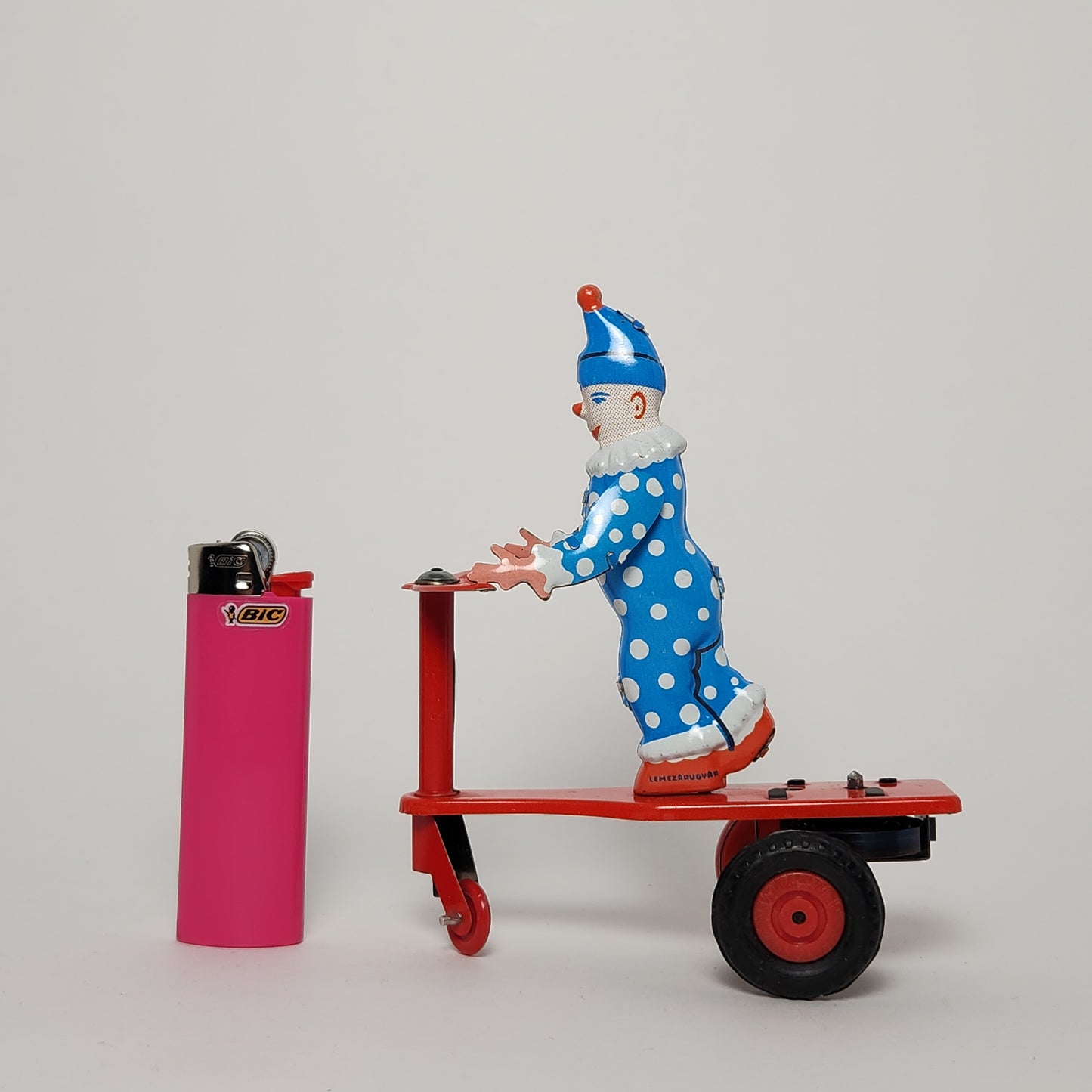 Lemezarugyar - Tin Lithographed Clown on Scooter Wind-up Toy