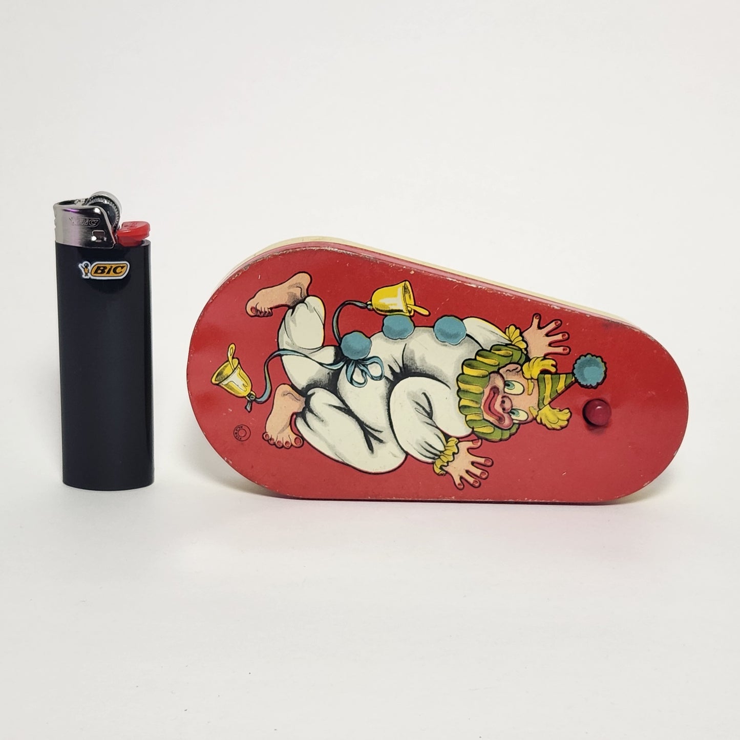 Tin Lithographed Dancing Clown Noisemaker Toy with Wooden Handle