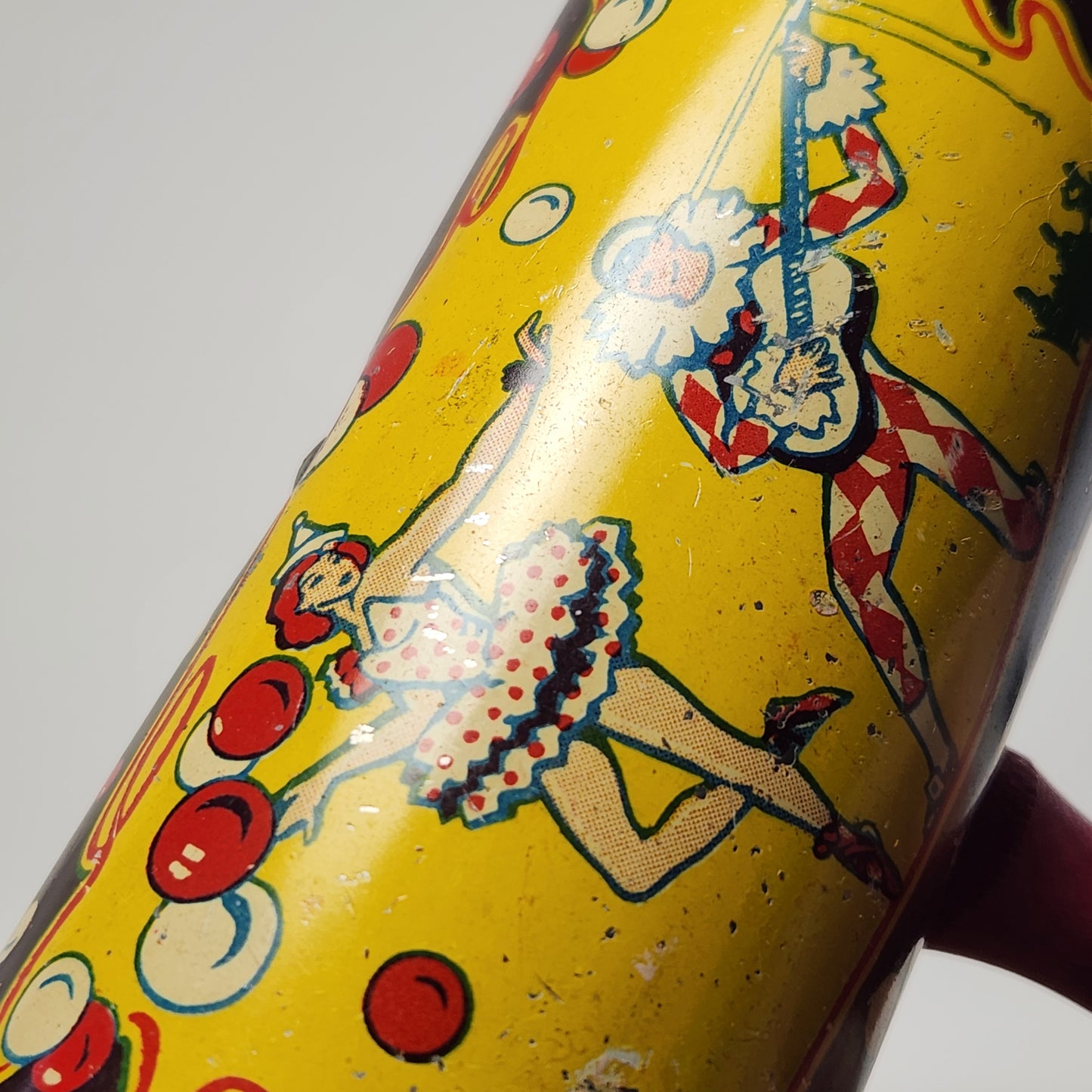 Kirchhof - Tin Lithographed Clown Noisemaker Toy with Wooden Handle (Yellow)