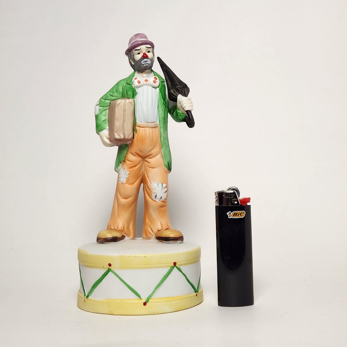 Flambro - Emmett Kelly Jr. - Hobo Clown with Umbrella Porcelain Bisque Music Box 1984