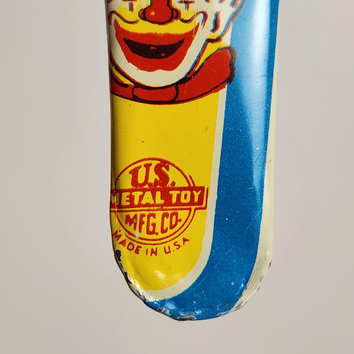 US Metal Toy Manufacturing Company - Tin Lithographed Clown Noisemaker Toy
