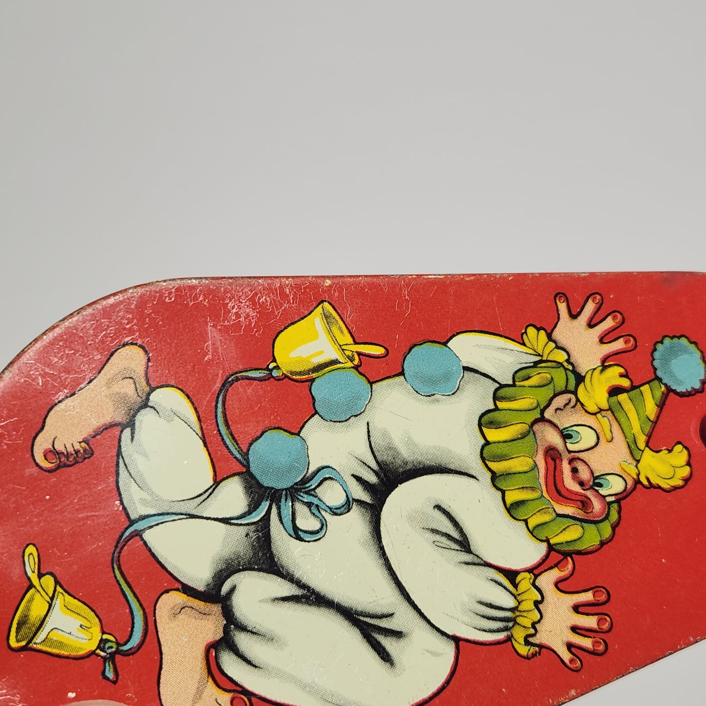 Tin Lithographed Dancing Clown Noisemaker Toy with Wooden Handle