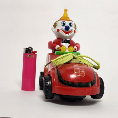 Motorized Light-Up Clown in Car Toy